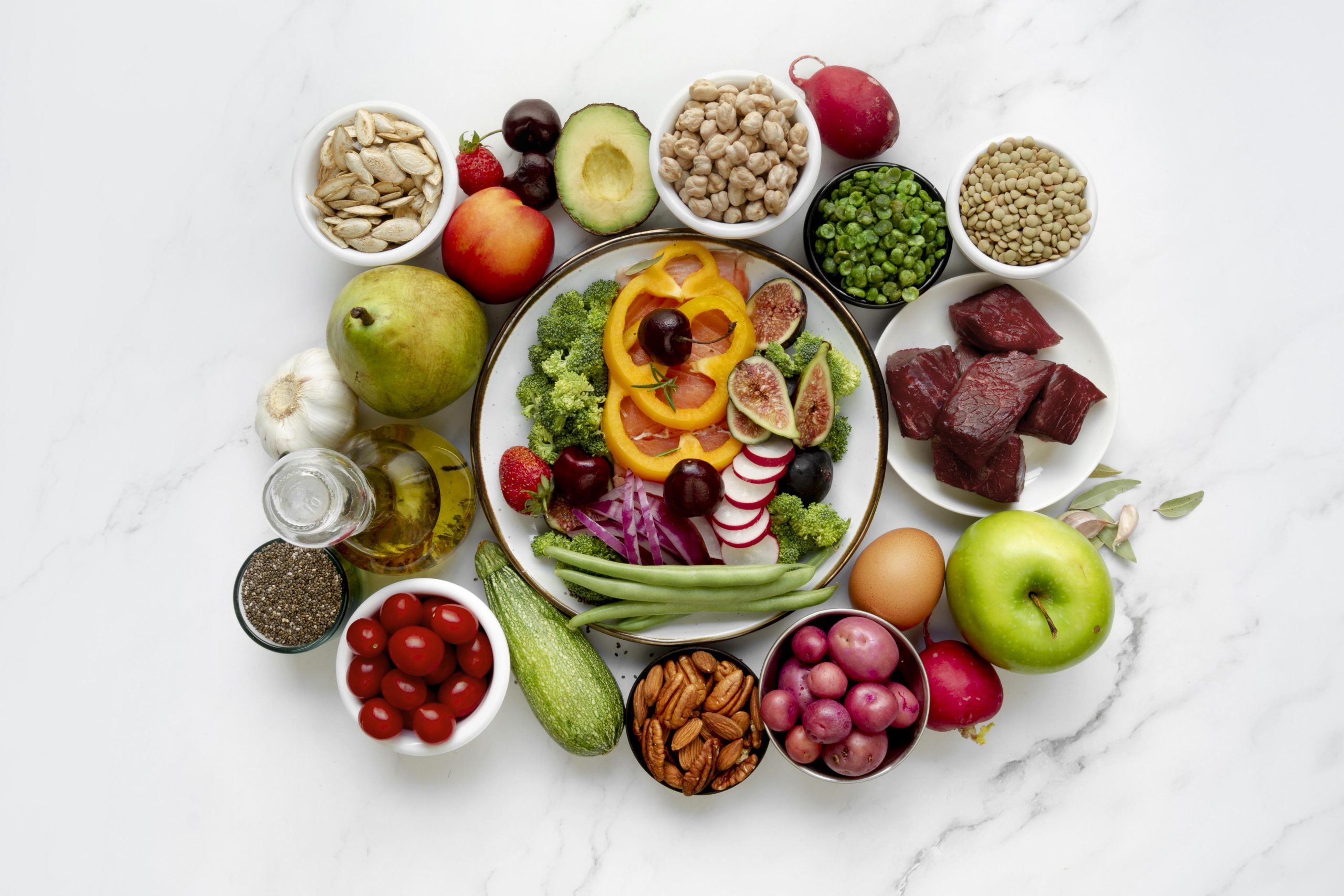A balanced meal, with fruits, vegetables, nuts, and pulses.